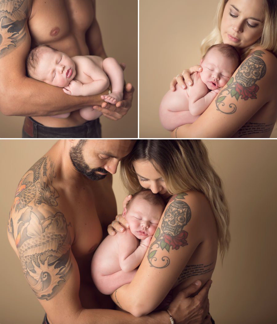 parents avec un bébé dans les bras